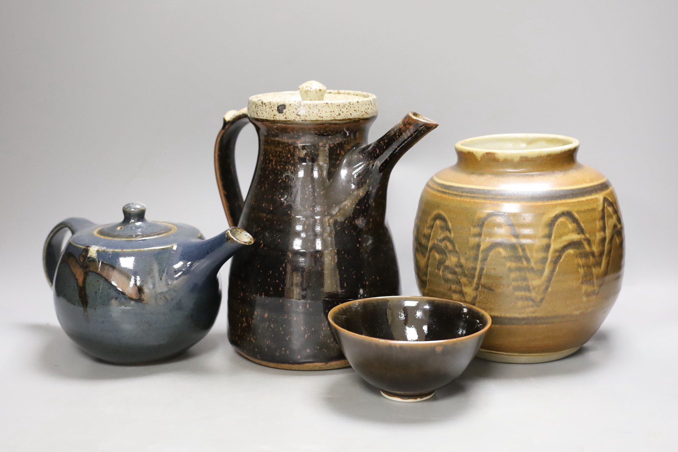 Geoffrey Whiting (1919-1988), a studio pottery teapot and coffee pot, a vase, together with an unattributed porcelain bowl. (4)-coffee pot 22cms high.